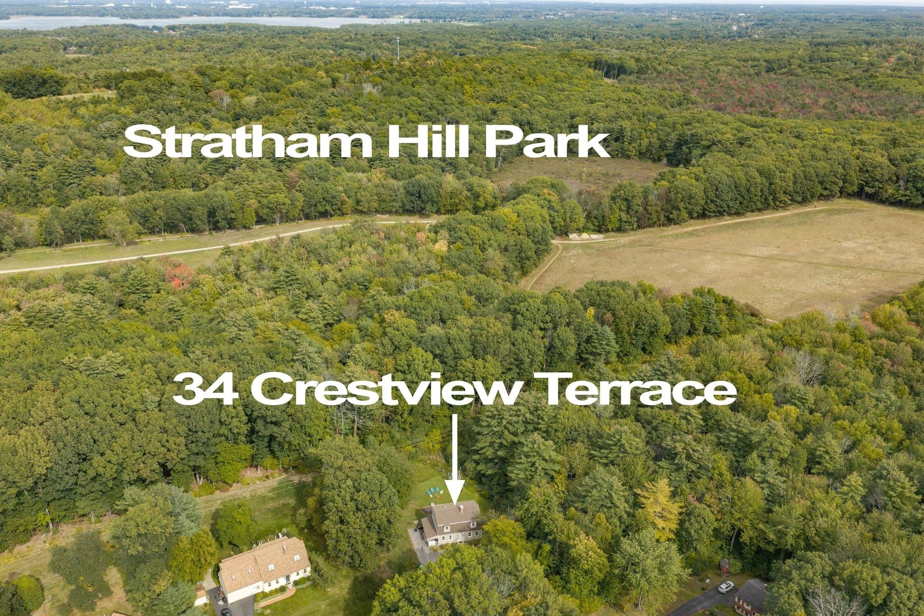 The house from the air with Stratham Hill Park's fields beyond, labeled by the photographer